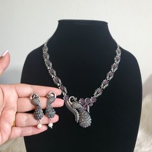 Vintage style peacock necklace earrings set.
